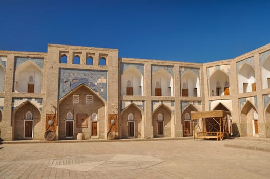 Square in old town in Khiva, historic site and tourist destination in Uzbekistan