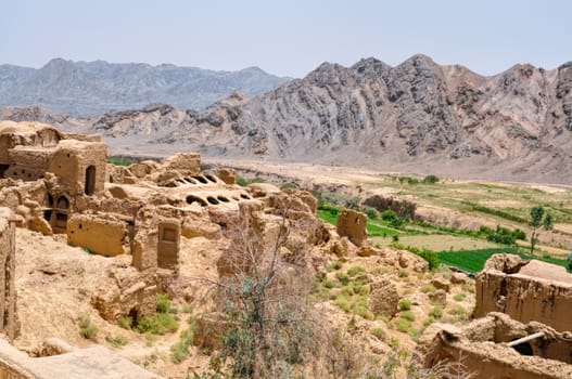 Ruins of old houses in village of Kharanaq in Iran