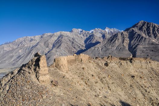 Scenic ancient ruins on the ridge in Pamir mountains in Tajikistan