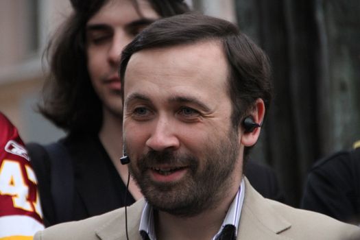 Moscow, Russia - on May 27, 2012. The politician Ilya Ponomarev speaks at an oppositional action. After disputable elections the opposition organized many protest actions on streets of Moscow. This meeting - public political club in the fresh air on Stary Arbat Street at a monument to the poet Okudzhava