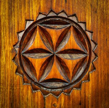 traditional folk art carved pattern on wood