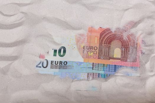 Euro Notes in Sand