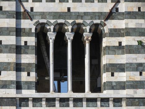 Siena, Italian medieval town - detail of a window of the cathedral steeple