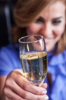 Smiling woman making a toast