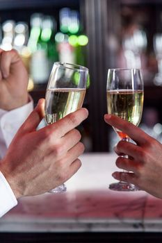 Young couple in love making a toast