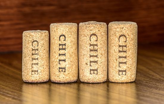 Four corks of Chile wine bottles with wood background