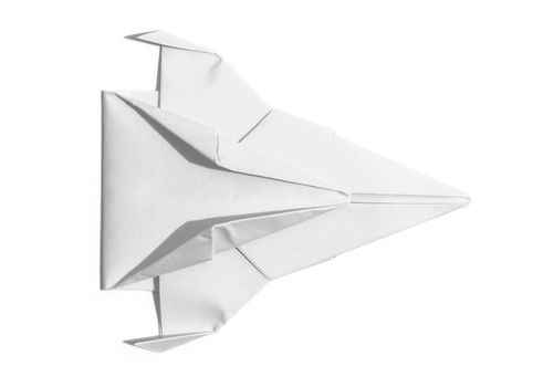 Overhead view of a nice origami spaceship isolated over a sheet of paper
