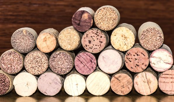 Several corks of wine bottles arranged in transverse position, front focus.