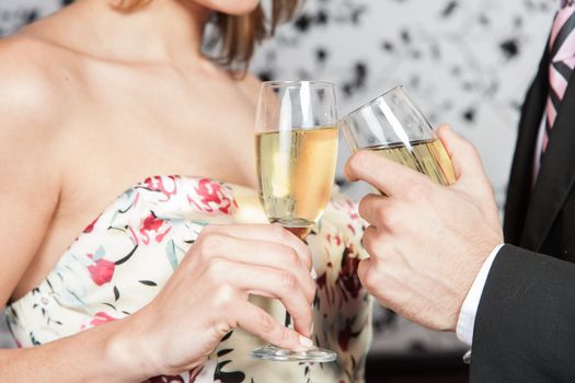 Young couple in love making a toast