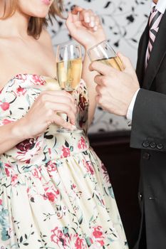 Young couple in love making a toast