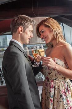 Young couple in love making a toast