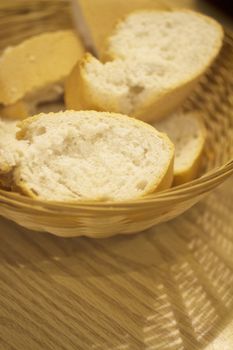 White baguette bread basket on table photo.