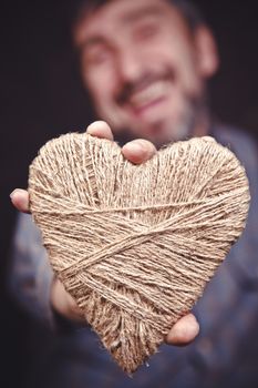 Man holding heart in his hands