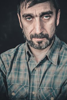 Portrait of a serious man with a beard