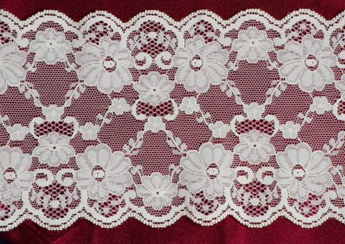 lace on the red satin fabric