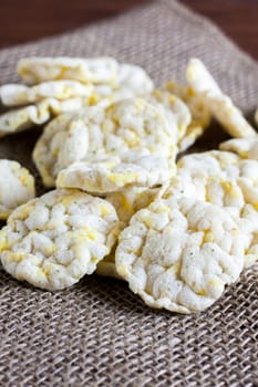 Puffed rice cakes on a wooden table.