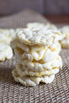 Puffed rice cakes on a wooden table.