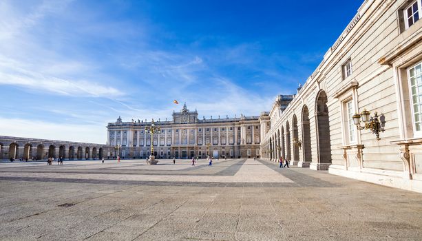 Madrid, Spain - May 6, 2012: Royal palace (Palacio Real de Madrid) with tourists on spring day in Madrid, Spain