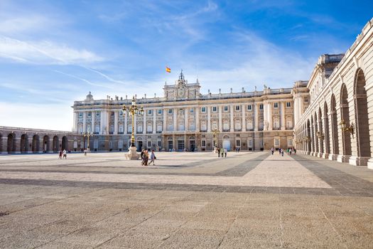 Madrid, Spain - May 6, 2012: Royal palace (Palacio Real de Madrid) with tourists on spring day in Madrid, Spain
