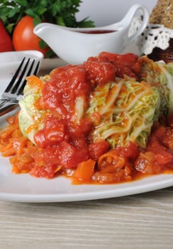 stuffed savoy cabbage under onion-carrot gravy