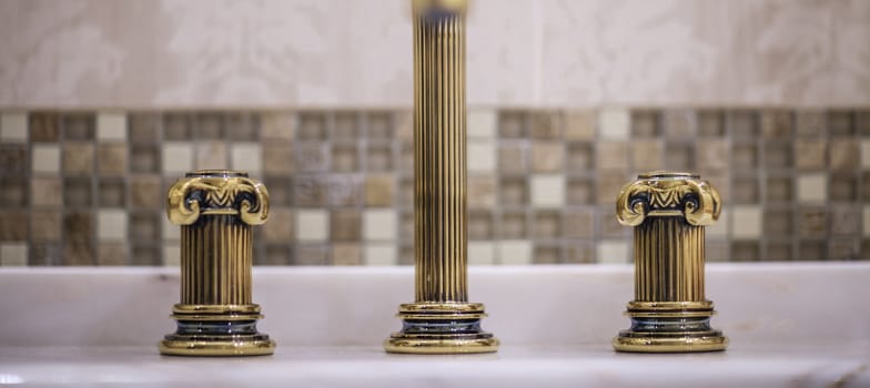 washbasin faucet in luxury bathroom Shallow depth of field