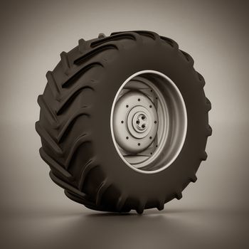 Tractor wheel isolated on gray background. black and white