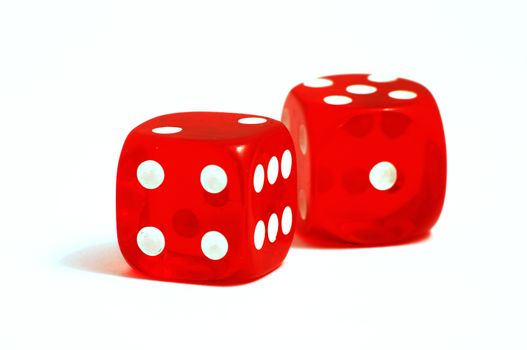 Two red casino dice on a white background