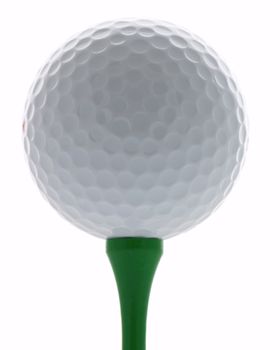 Golf ball on a green tee