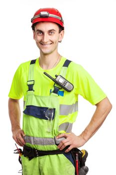Young handsome contractor in light green uniform. Isolated over white background