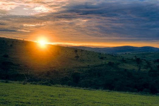 Sunrise over green landscape Carrancas in Brazil, south America