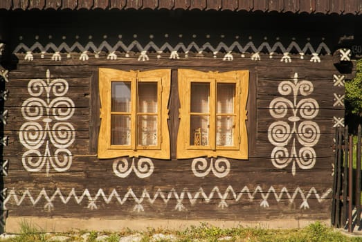 Painted facade of traditional wooden house in Slovakia in famous village of Cicmany