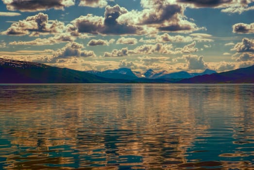 Dramatic clouds over Lofoten islands in Norway viewed from ferry             