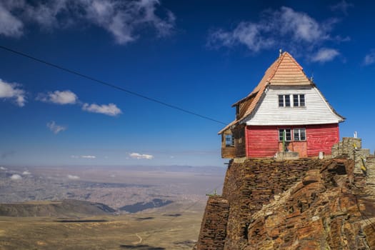 Wooden hut on the edge of cliff on mountain Chacaltaya in south american Andes