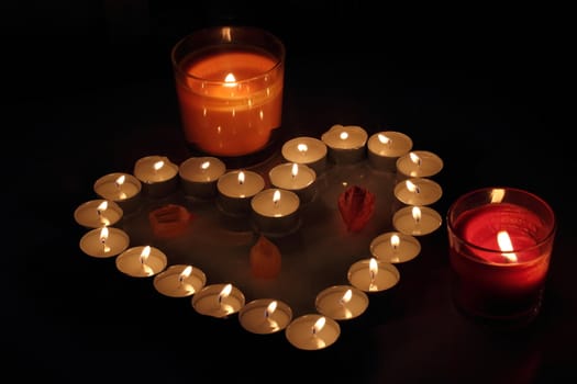 Heart of candles, a sign of love. romantic evening