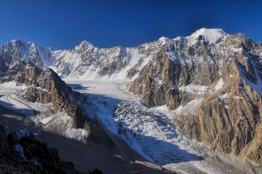 Majestic mountain peak and glacier in Tian Shan mountain range in Kyrgyzstan