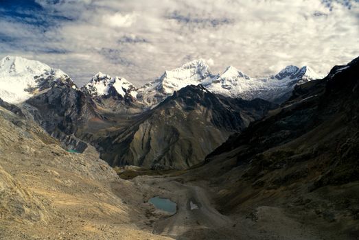 Deep canyons around Alpamayo, one of highest mountain peaks in Peruvian Andes, Cordillera Blanca