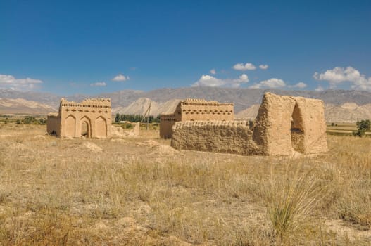 Ruins of ancient temple on arid landscape in Kyrgyzstan