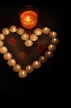 Heart of candles, a sign of love. romantic evening