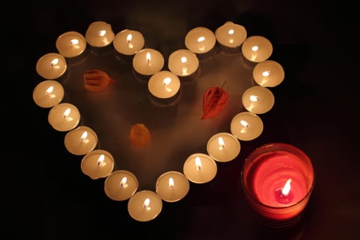 Heart of candles, a sign of love. romantic evening