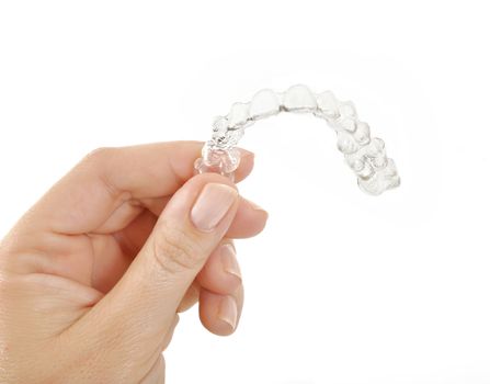 Invisible braces in a woman's hand