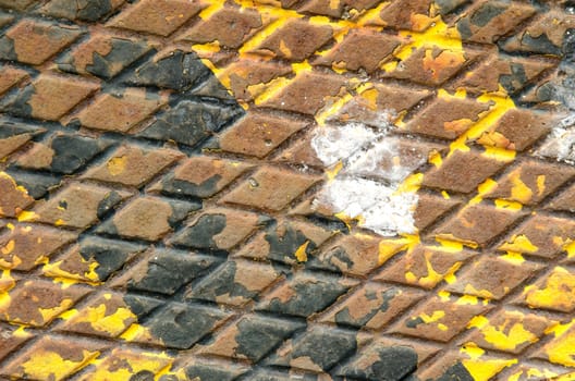 Old black and yellow rusty iron surface texture with white stain.