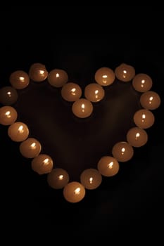 Heart of candles, a sign of love. romantic evening