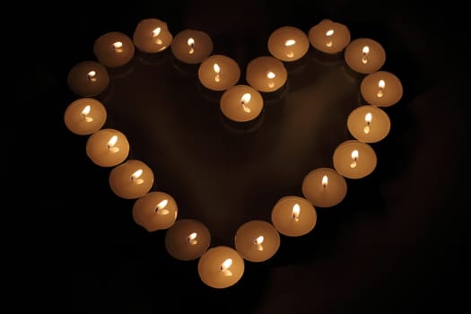 Heart of candles, a sign of love. romantic evening