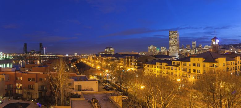 Portland Oregon Downtown Waterfront Cityscape with Steel Bridge during Evening Blue Hour Panorama