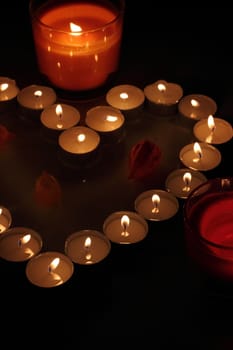 Heart of candles, a sign of love. romantic evening