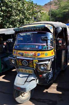 Jaipur, India - December 29, 2014:  Auto rickshaw taxis near Amber fort on December 29, 2014 in Jaipur, India. These taxis are popular type of transport among locals and tourists.