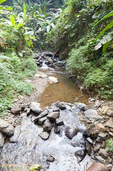 Waterfall that flows down from the mountains. Streams of water flowing down from the mountains. There is always a small stone waterfall.