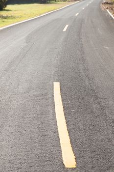 yellow curve on the road. The yellow curve on the road. Warned that the curve in this area