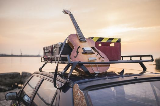 Vintage musical rusty grunge car luggage rack on the sea shore