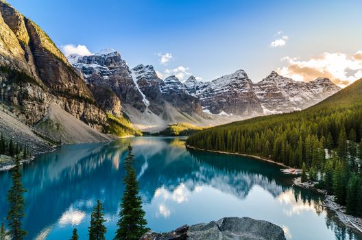 Landscape view of Moraine lake and mountain range at sunset in Canadian Rocky Mountains